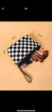 Zippered clutch checkerboard bag with leather patch